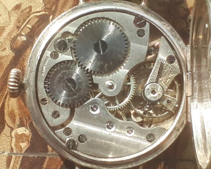 Image of ebauche movement. Link to silver trench watch, 1917.